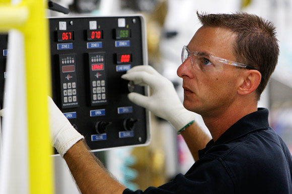 Chris Hocker operates the hot press at Renegade Materials Corp. Photos Ben French